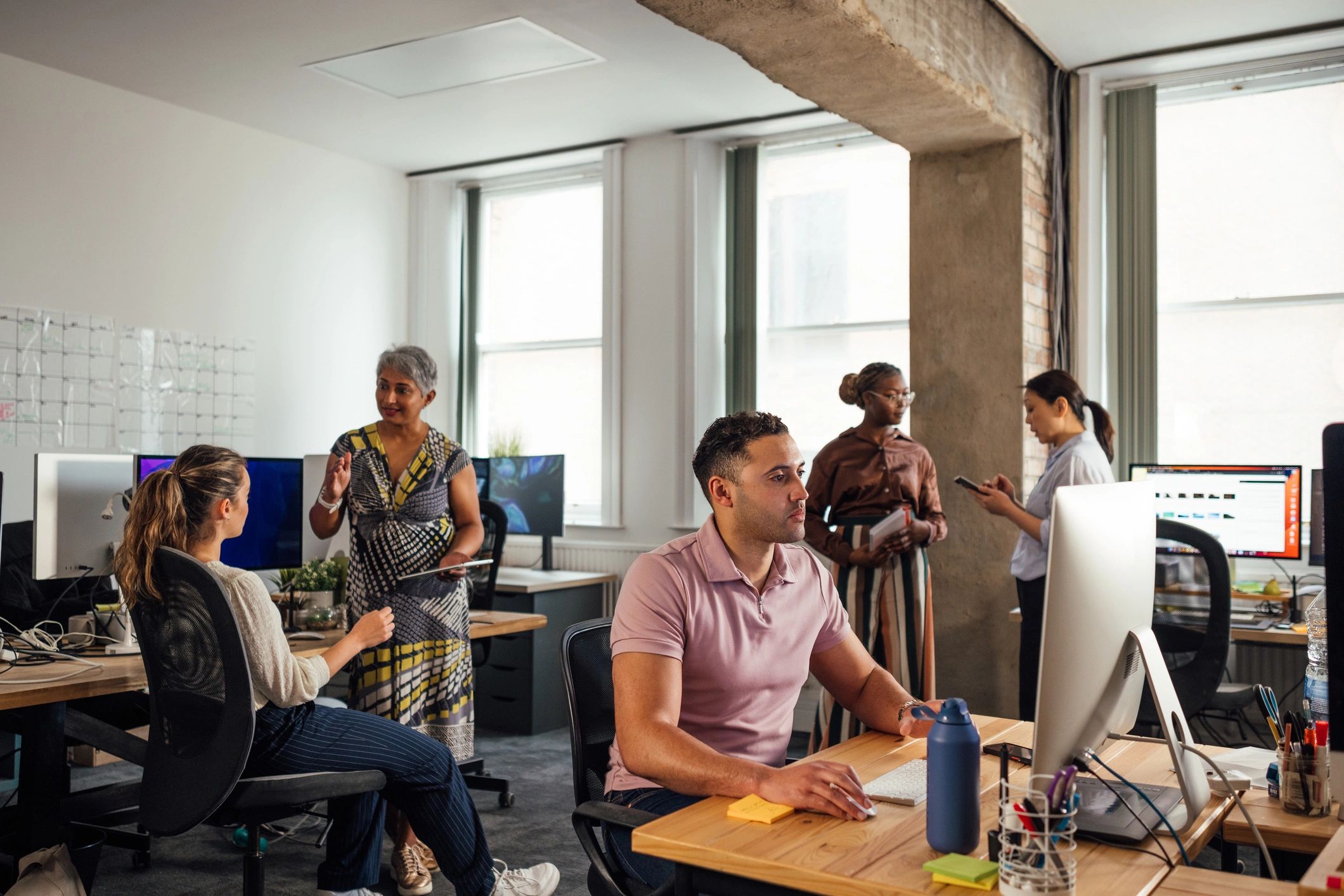 Small IT team supporting business operations in an office