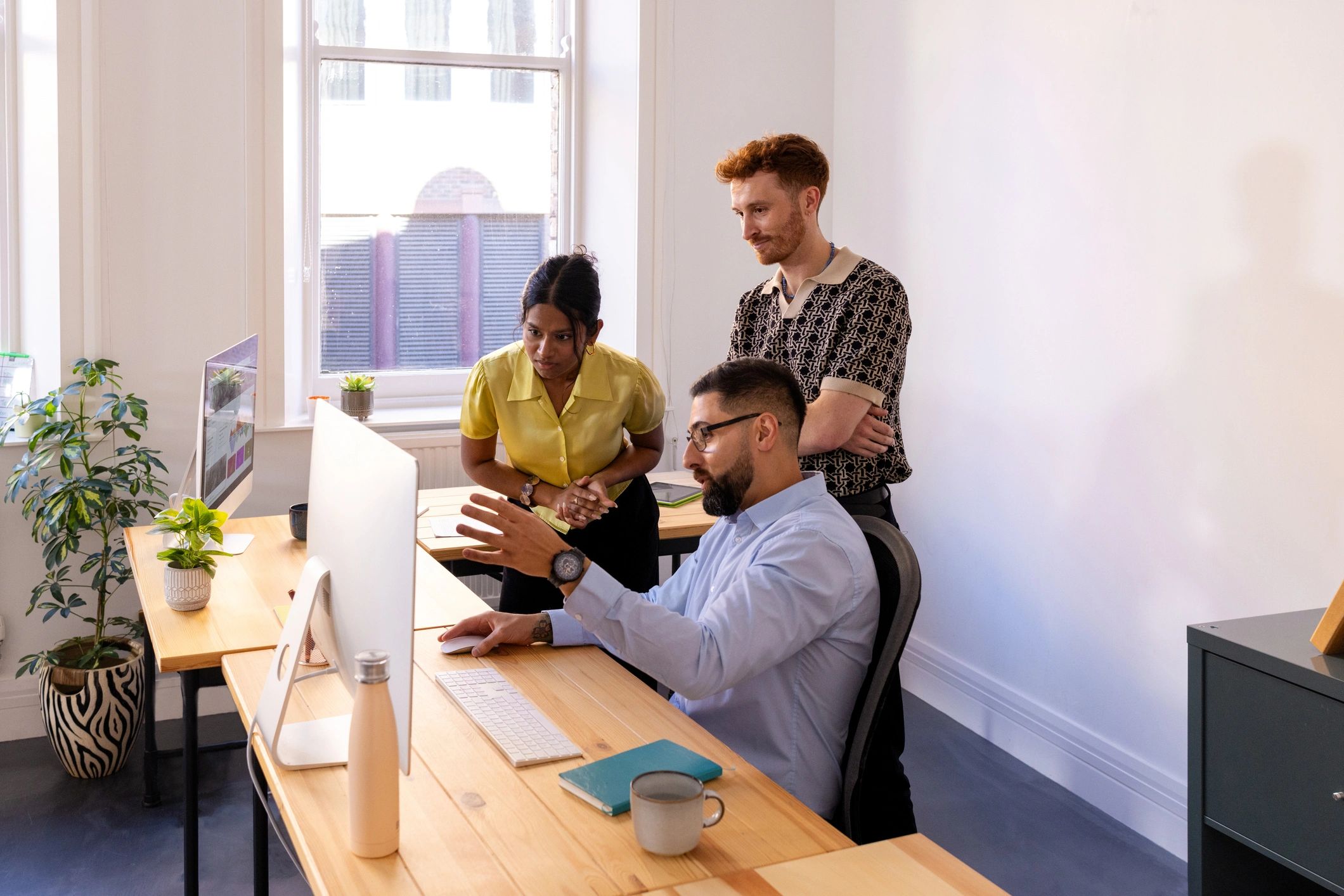 Small business team receiving technical support in an office